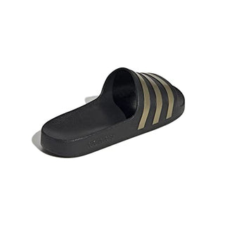 adidas unisex adult Adilette Aqua Slide Sandal, Core Black/Gold Metallic/Core Black, 10 Women Men US